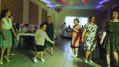 Grandmothers dancing at a wedding banquet 스톡 동영상 201358564