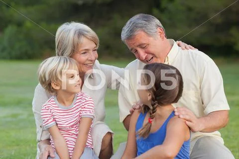 Grandparents chatting with grandchildren Stock Photos