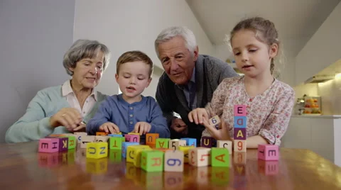 Grandparents playing with grandchildren Stock Footage