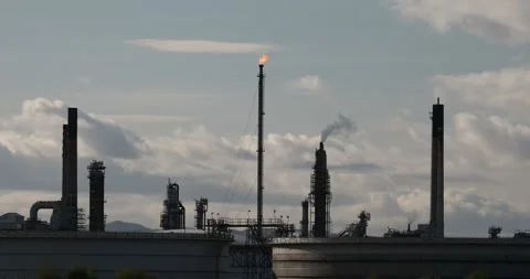 The Grangemouth oil refinery on the Firth of Forth flaring off waste gas in G Stock Footage 302473144