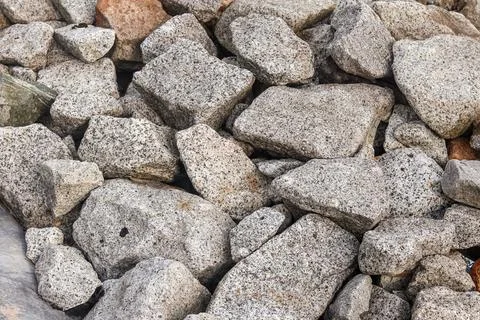 Granite aggregate stone blocks pile with speckled mineral texture Stock Photos