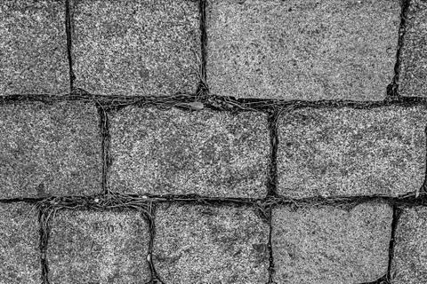 Granite background rectangular block gray toned pattern urban style stiff bas Stock Photos