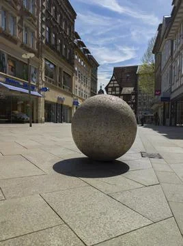 Granite ball on the square in Göttingen, Germany with cafes and shops Stock-Fotos
