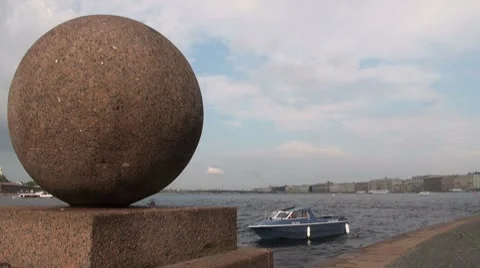Granite ball on the waterfront Stock Footage 7749687