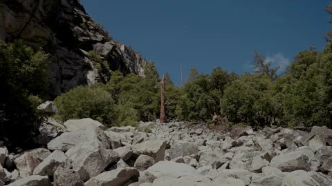 Granite boulder field below cliff Yosemite Stock-Footage 347986397