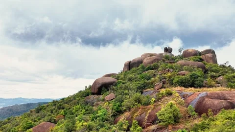 Granite Boulder Hilltop Under Cloudy Sky Video stock 345276927