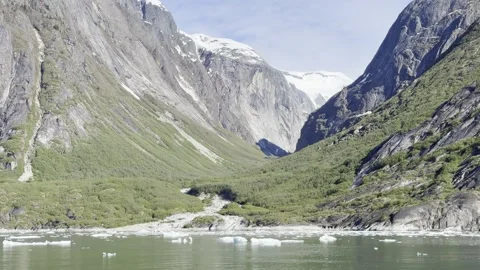 Granite buttresses frame a textbook U-valley with a hanging snowfield above Stock Footage 336218774