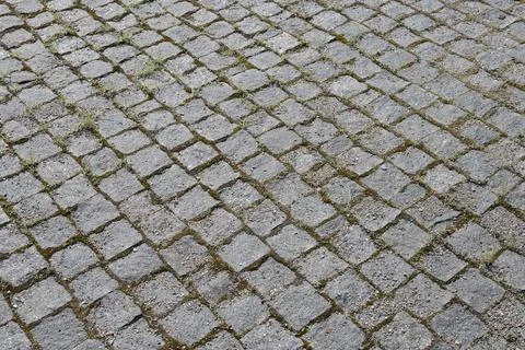 Granite cobblestone pavement background texture high angle Stock Photos