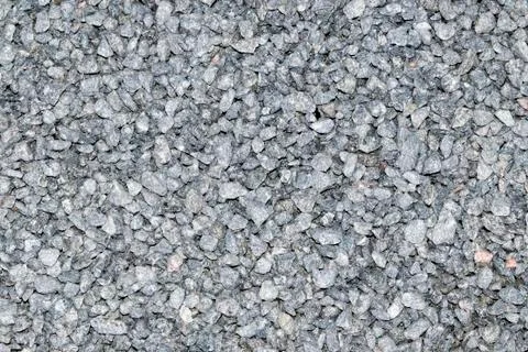 Granite crumb texture. Grey gritty rock surface. Non polished white granite a Stock Photos