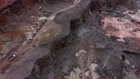 Granite extraction process at an industrial quarry in a rocky area Stock Footage 337935711