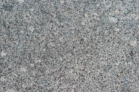 Granite gray wall of the old building. Textured background Stock Photos