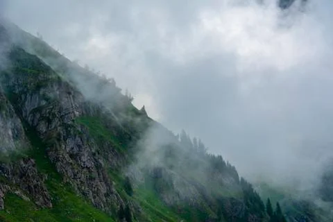 Granite mountains and clouds Stock Photos