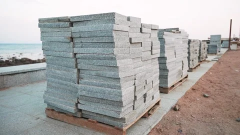 Granite paving slabs planks in a stack on a wooden pallets. Repair of city Video stock 253495885