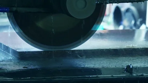 Granite plate cutting by a circular saw, blurred background Stock Footage 77372965