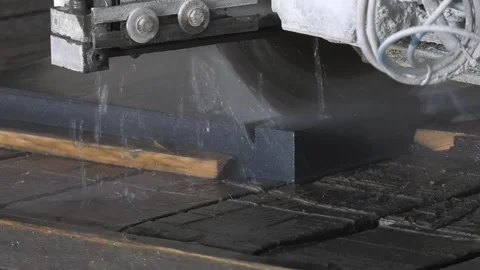 Granite processing in manufacturing. Cutting granite slab with a circular saw Stock-Footage 111244195