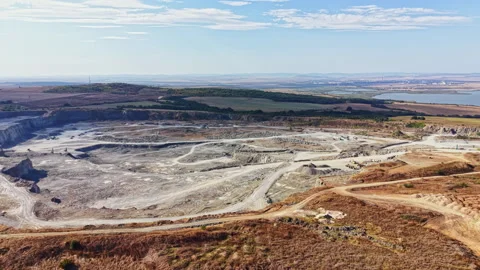 Granite quarry activity captured during daytime in a rural setting with vast Stock Footage 344781637