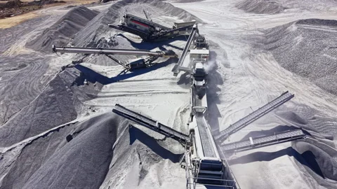 Granite quarry operation with machinery and materials in a mining site during Stock Footage 344776461