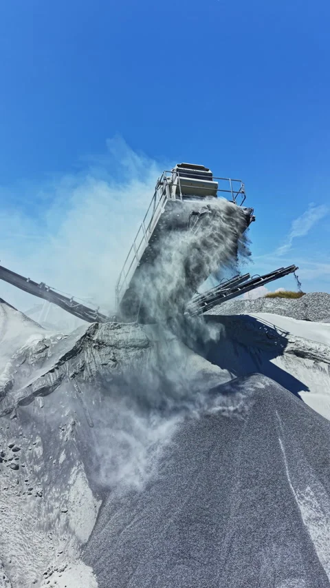 Granite quarry processes stone crushing and material movement during a sunny day Stock Footage 337885319