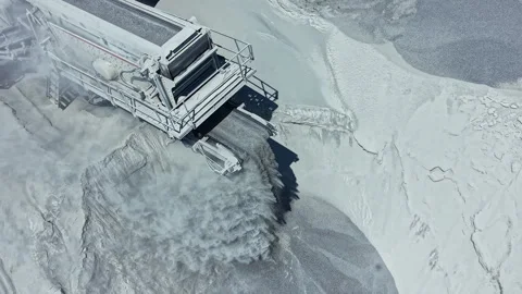 Granite quarry showing machinery working to process stones at a site during Stock Footage 337904203