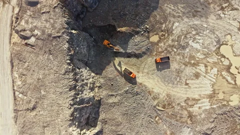 Granite quarry shows machines working on stone extraction in a busy construction Stock Footage 340936349