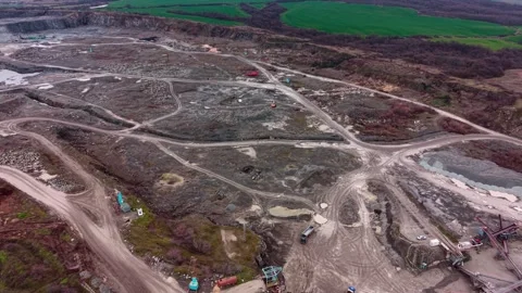 Granite quarry site shows active industrial processes near green landscapes Stock Footage 337862411