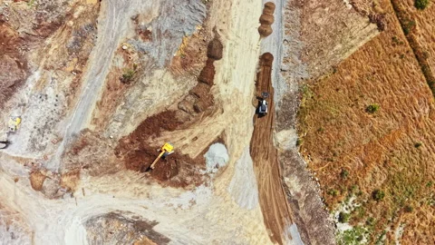 Granite quarry site with workers and machinery operating in the area during Stock Footage 340938981