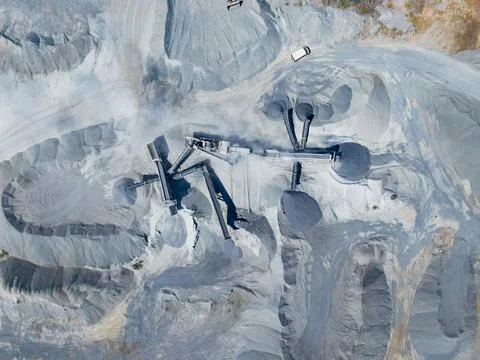 A granite quarry where different machines are used for extracting and process Stock Photos