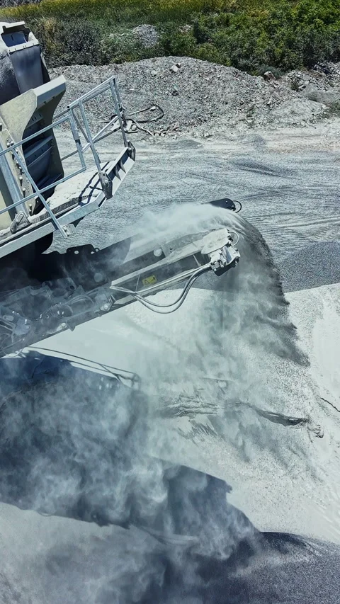 Granite quarry workers operate heavy machinery to extract granite stone while Stock Footage 337909560