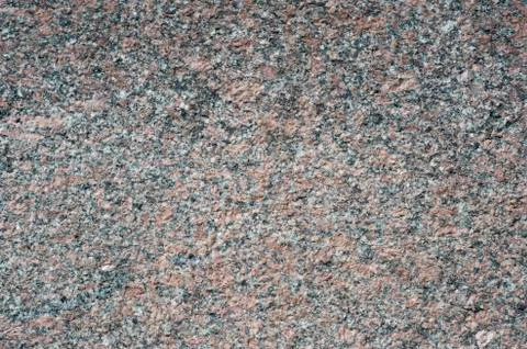 Granite rough texture of the building. Background Stock Photos
