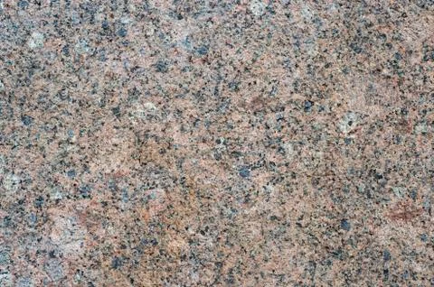 Granite rough texture of the building. Background Stock Photos