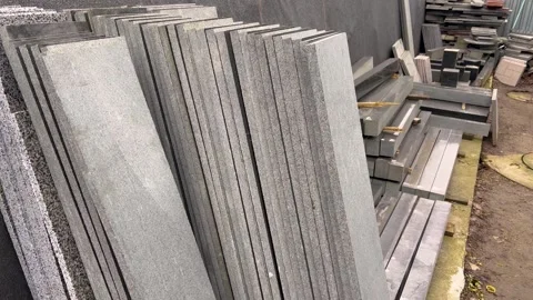 Granite slabs stand in rows. Granite slabs for tombstones. Workshop Video stock 273371925