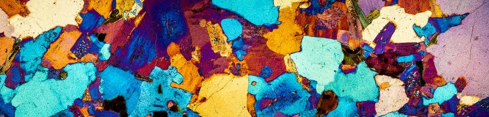 Granite stone cut under the microscope in polarized light Photos