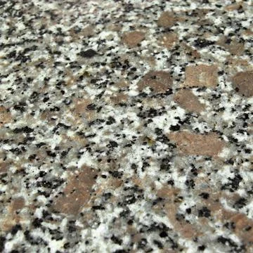 Granite stone pattern useful as background or texture, natural black white be Stock Photos
