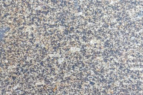 Granite stone texture with rough gray surface material Stock Photos