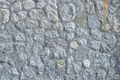 Granite stone wall, pattern of natural gray granite stone wall for background Foto stock