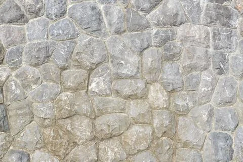 Granite stone wall, pattern of natural gray granite stone wall for background Foto stock