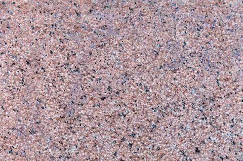 Granite surface close up. Granite stone texture background. Detail of grani.. Stock Photos