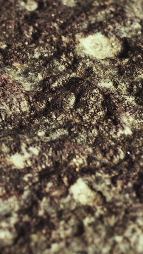 Granite surface with texture and variations in color showing natural patterns Stock Footage 348091733