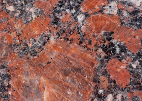 Granite texture. Reddish-brown base with black and gray spots. Background. Foto stock