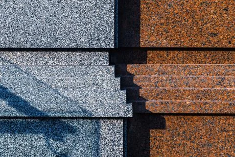 Granite wall of building Stock Photos