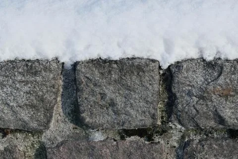Granite wall in the snow Stock Photos