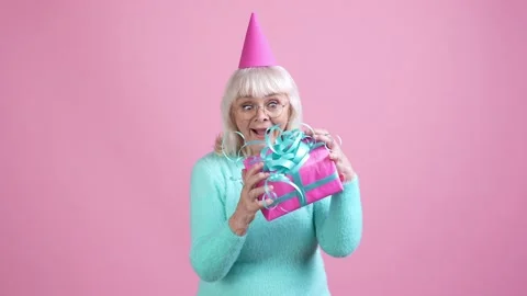 Granny lady catch package embrace isolated pastel color background Stock Footage 169288045