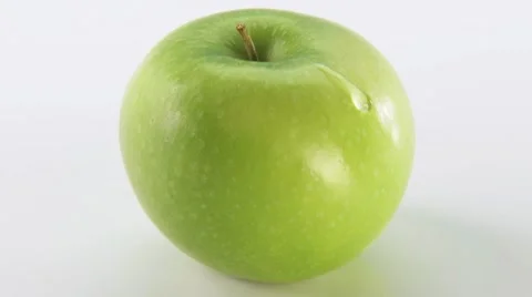 A Granny Smith apple with a drop Stock Footage 8572000