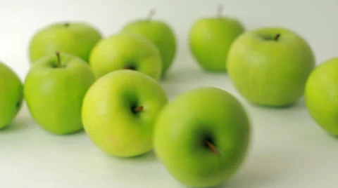 Granny Smith apple moves on a white background Video stock 58205514