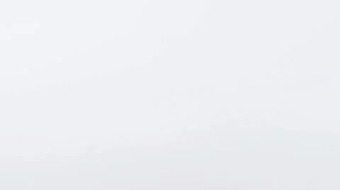 A Granny Smith apple rolling on a white background Stock Footage 8572001