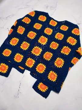 Granny square crocheting, crochet pattern, sunflower cardigan Stock Photos