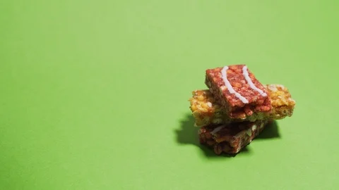 Granola bars stack on top of each other stop motion against chromakey Stock Footage 126122946
