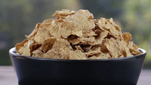 Granola cereal, nuts and raisins rotating . Crunchy tasty muesli food background Stock Footage 77764553