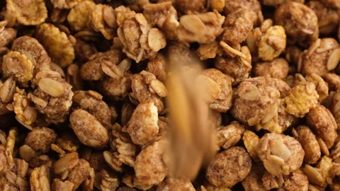 Granola falling down in plate, close up Stock-Footage 300340083