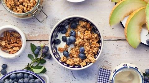 Granola  with natural yogurt, stop motion 4K Stock Footage